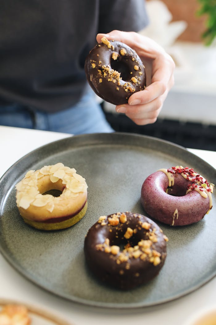 A Person Holding a Donut